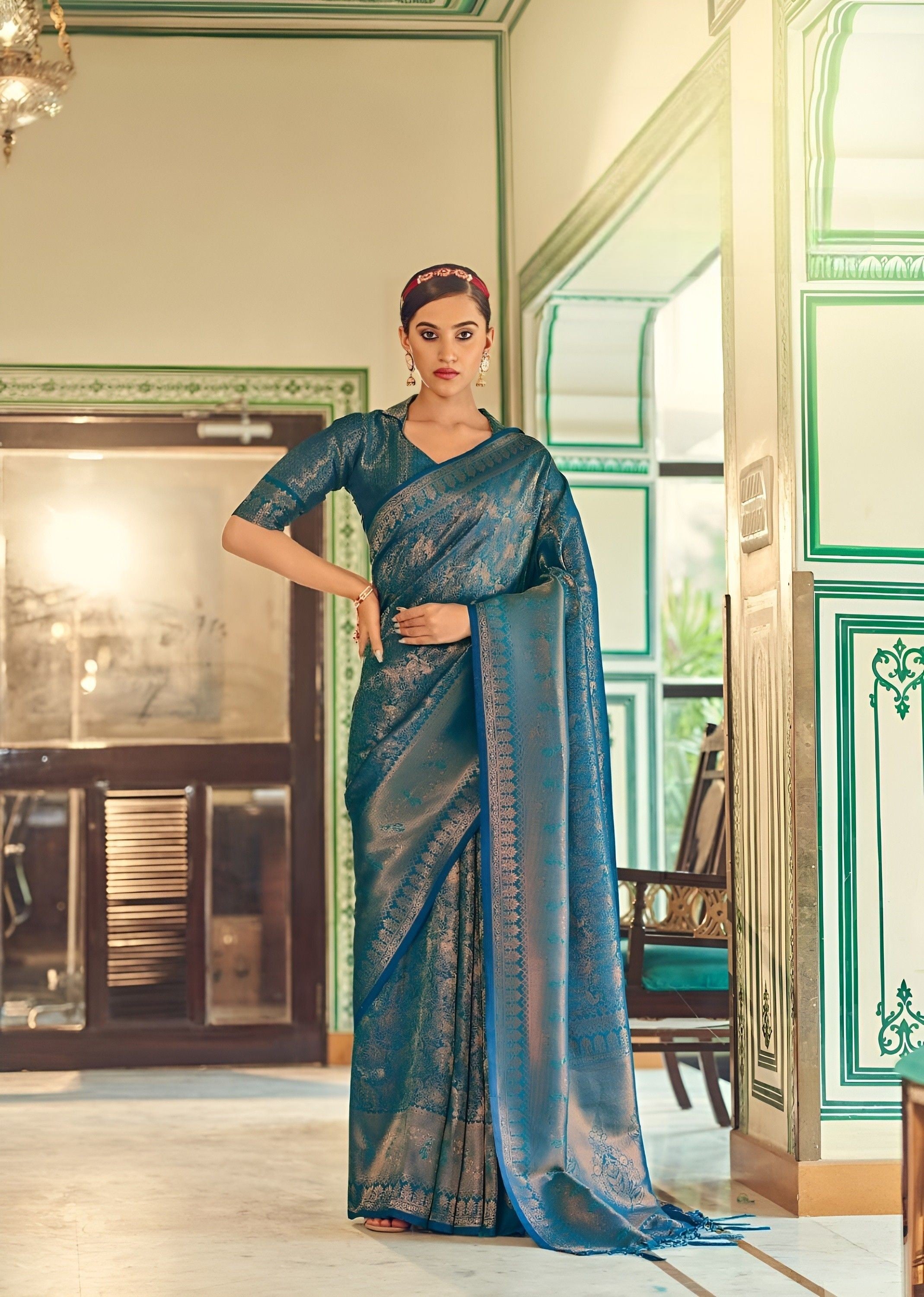 Varuni Gopen Collections - HAATHI Royal blue handloom saree which has self  weaved elephant motifs with green thread embroidered all over the sari  comes with an unstitched green raw silk blouse material (